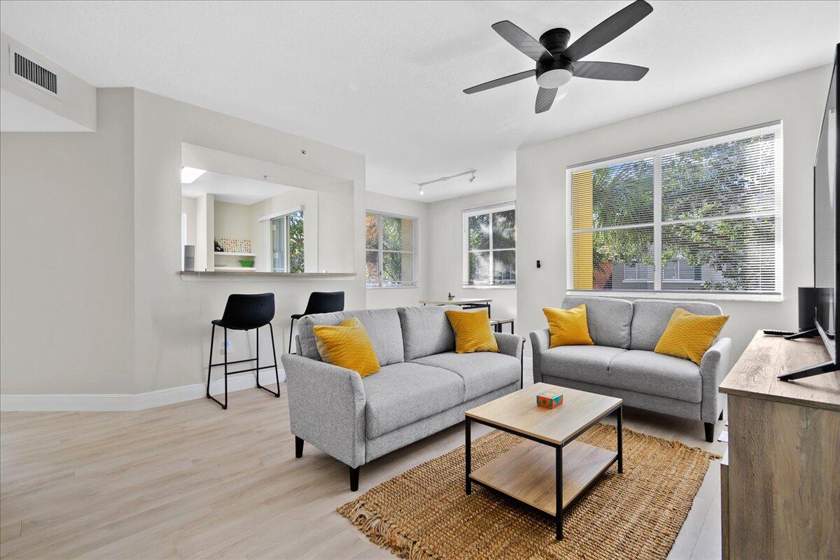 a living room with furniture and a large window