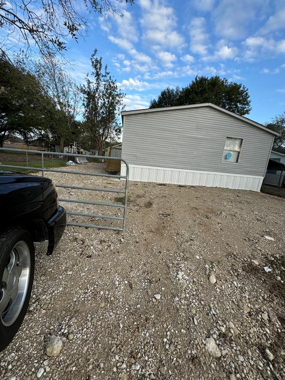 a view of a backyard of the house