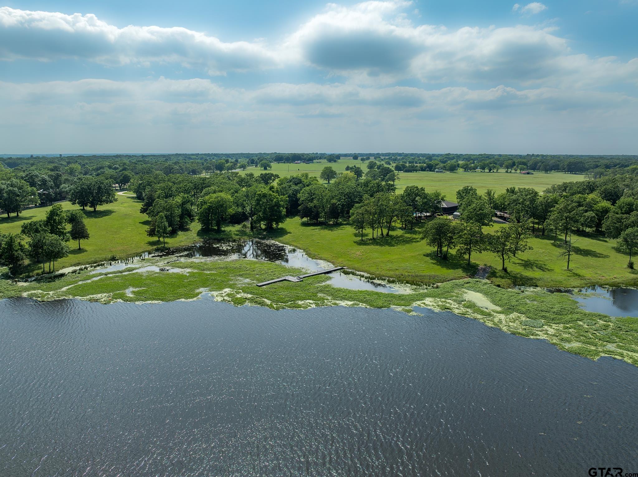 a view of a golf course with outside space