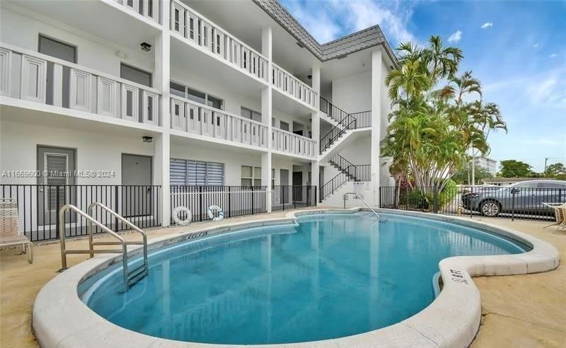 a view of a house with swimming pool