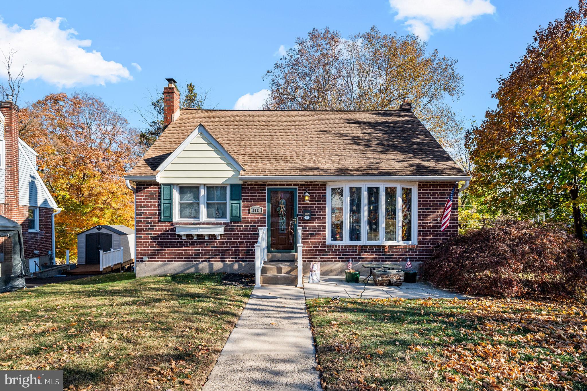 a front view of house with yard nad seating space