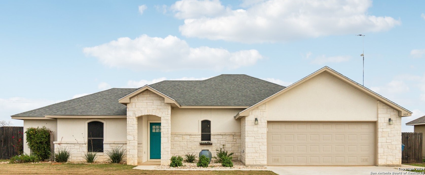 a view of house with yard