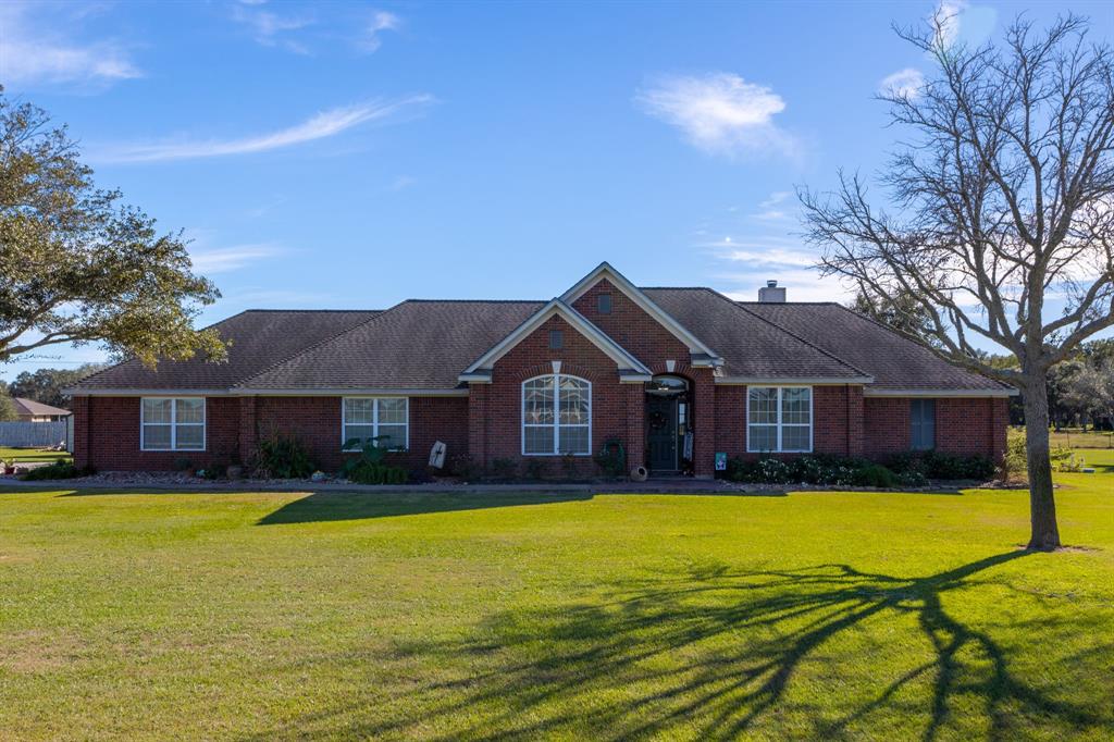 a view of a house with a big yard