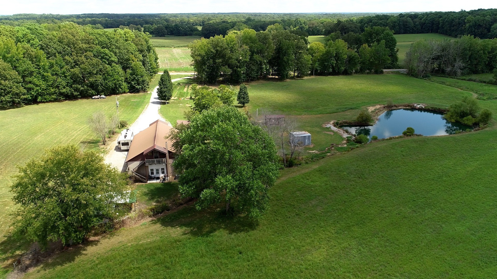 Make this beautiful, lush land your new home! Relax by fishing your own private stocked pond while enjoying fruit from the trees.