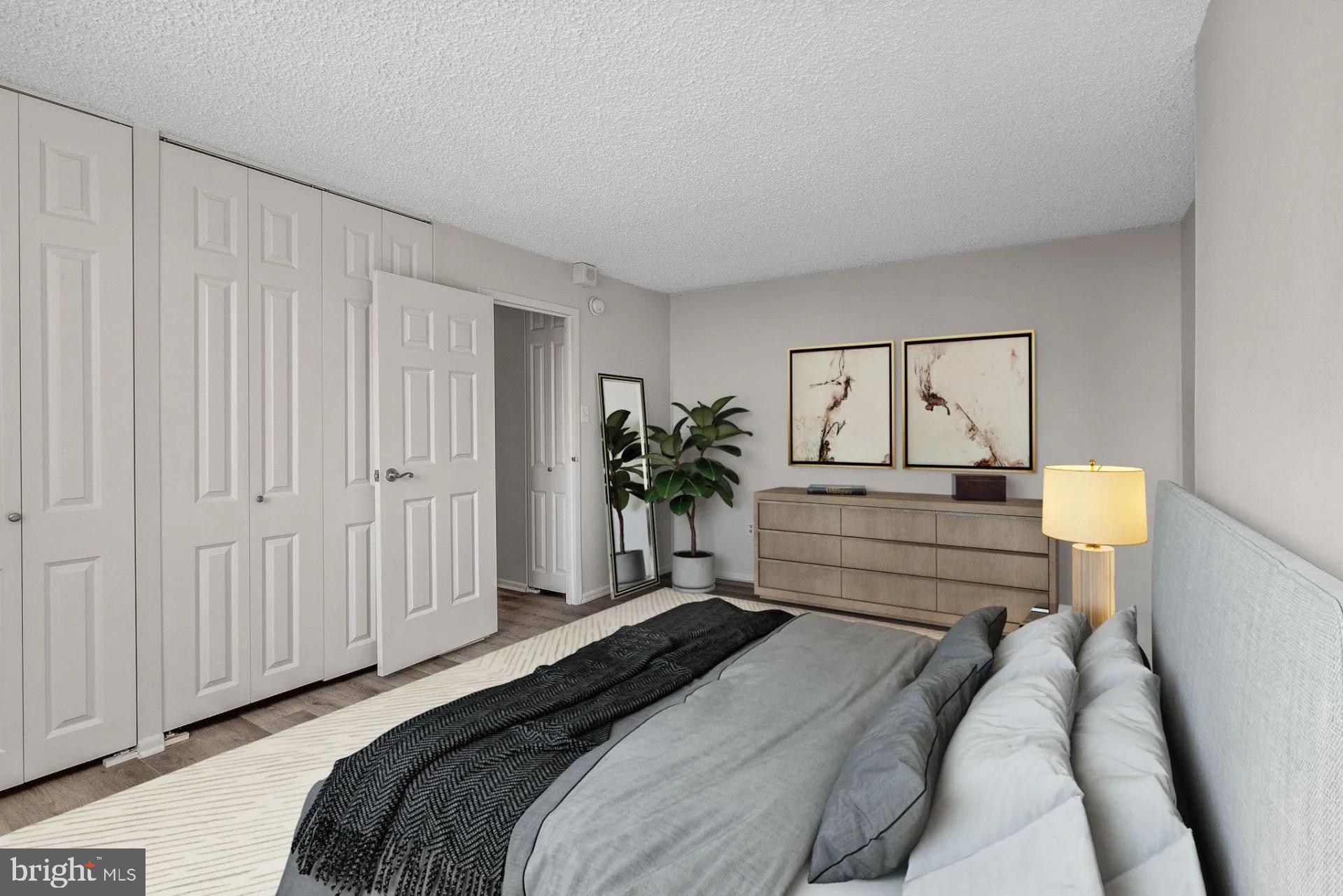 a bedroom with a bed and a cabinets