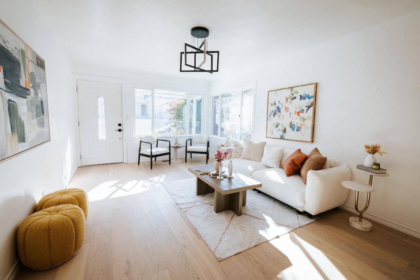 a living room with furniture and stairs