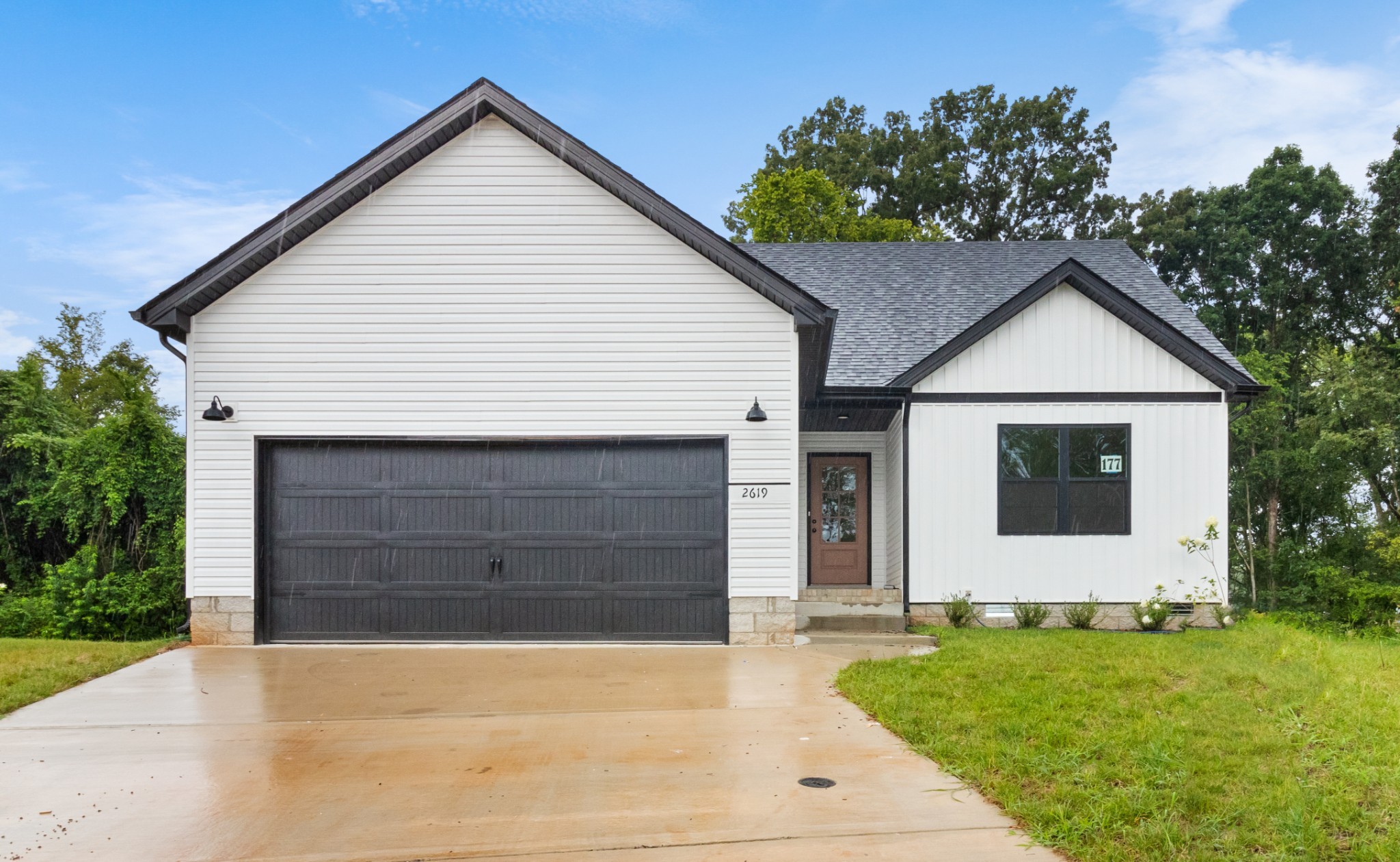 a front view of house with garage