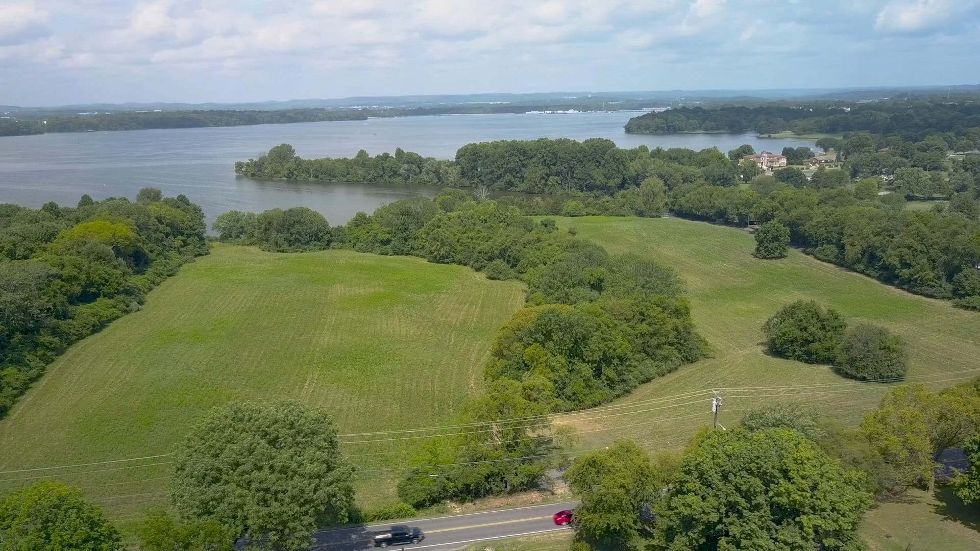 a view of a lake with a yard