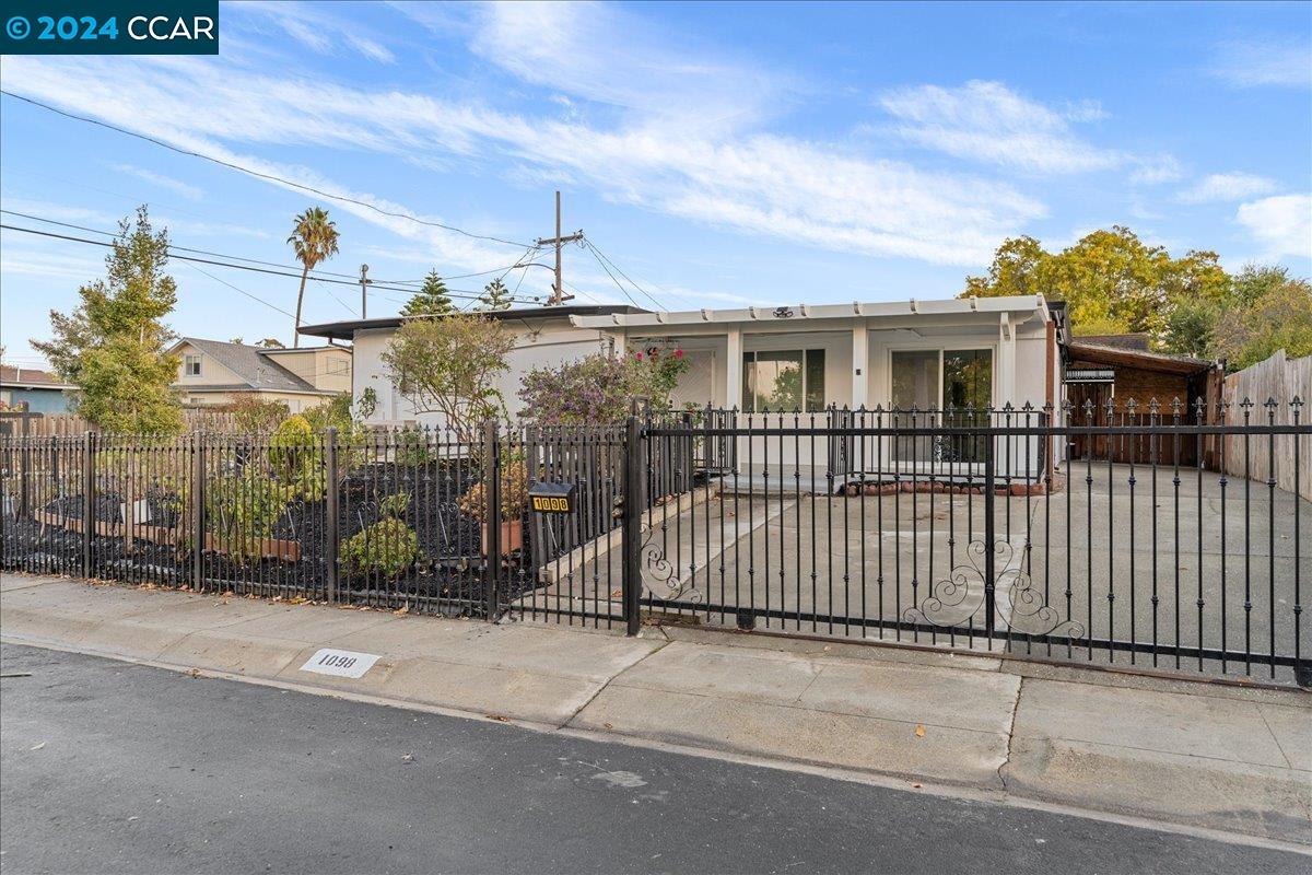 a view of a brick house with a street