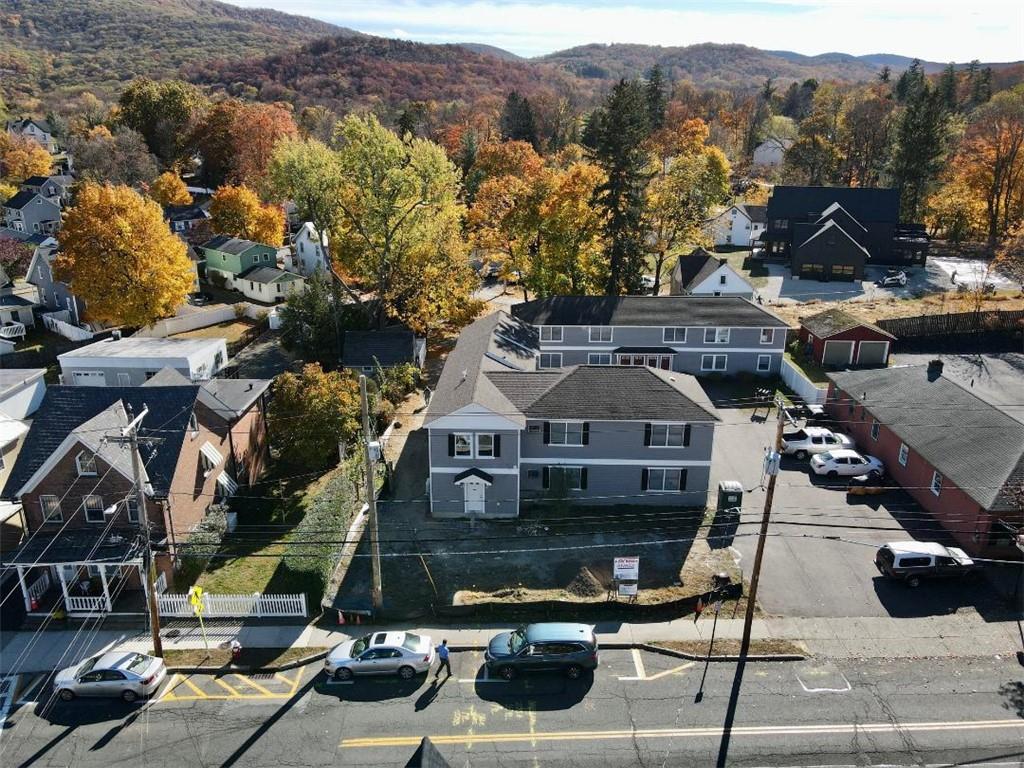 Front of complex with access from Hudson Street and view of part of parking area.