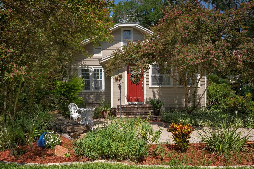 a front view of a house with garden