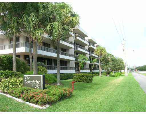 a view of an apartment with a garden