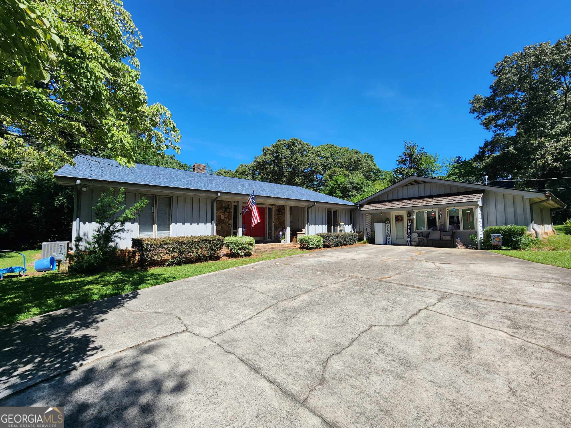 a front view of a house with a yard and porch