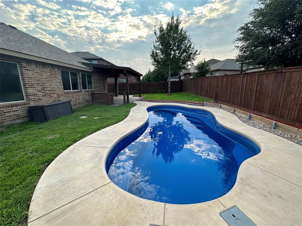 a view of a backyard with a garden