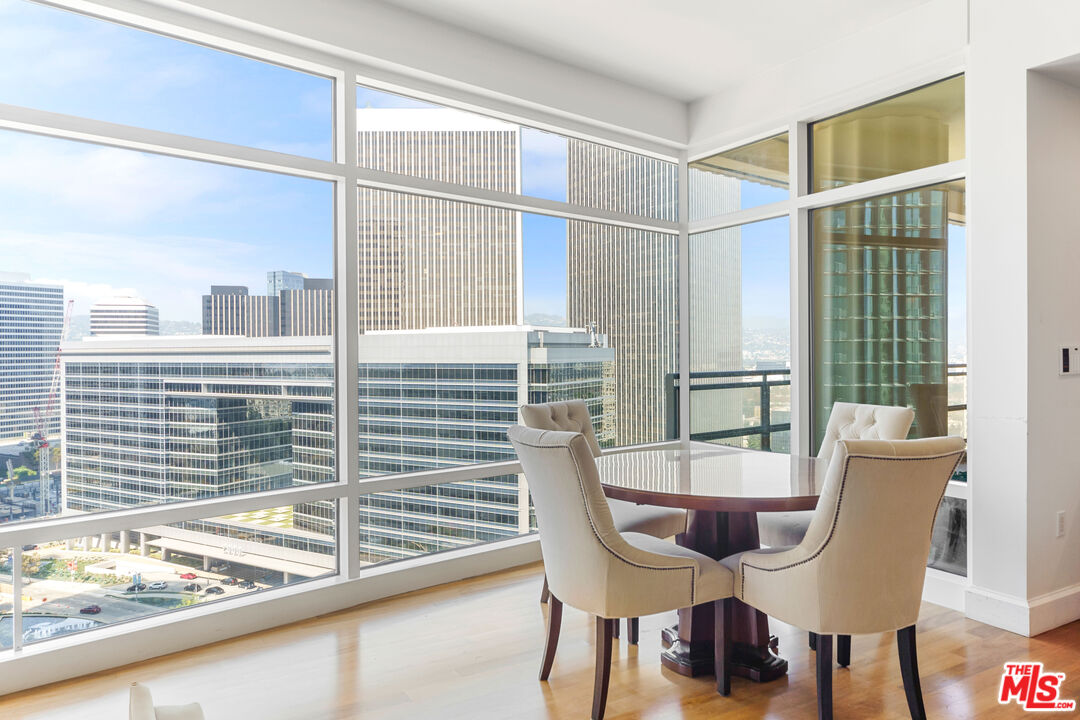 a view of a dining room with furniture and a window