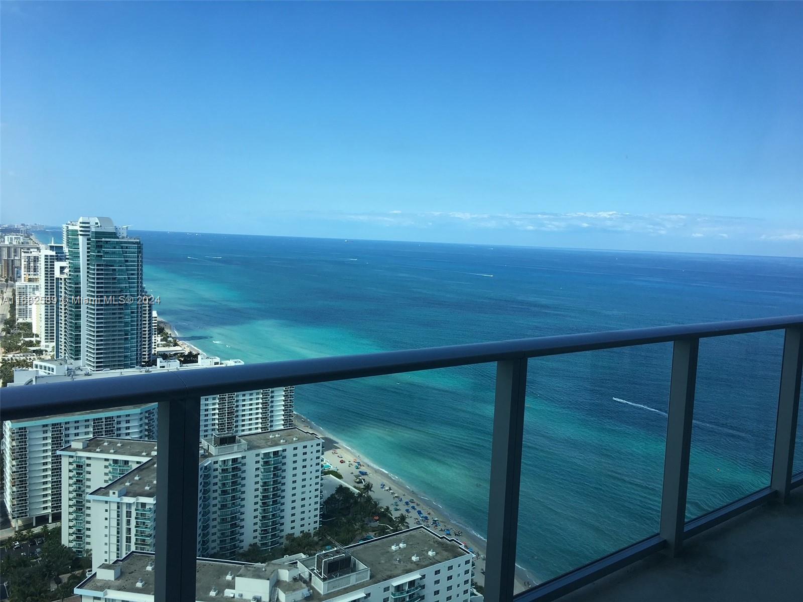 a view of a balcony with an ocean view