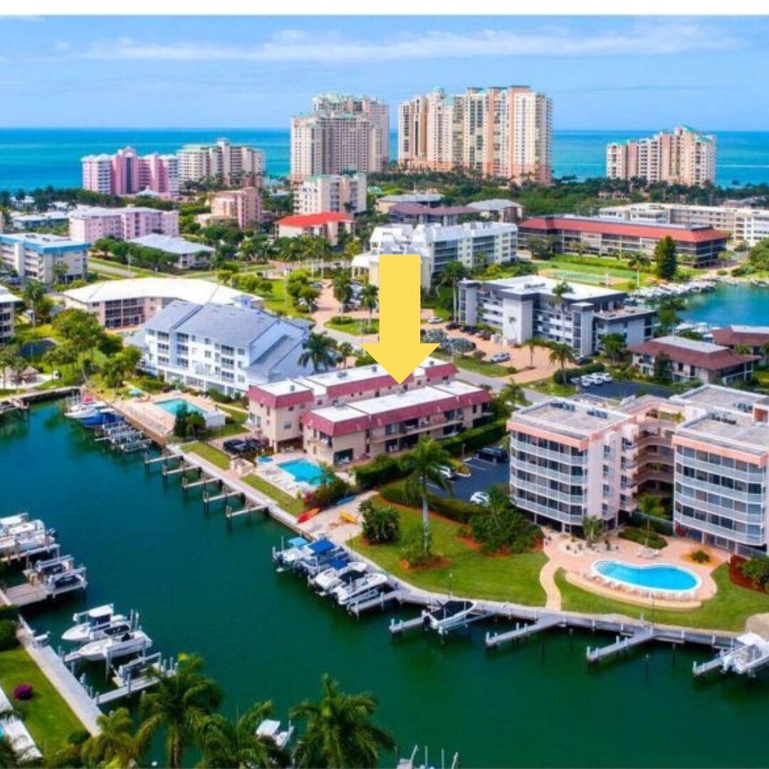 a city view with boat and outdoor seating