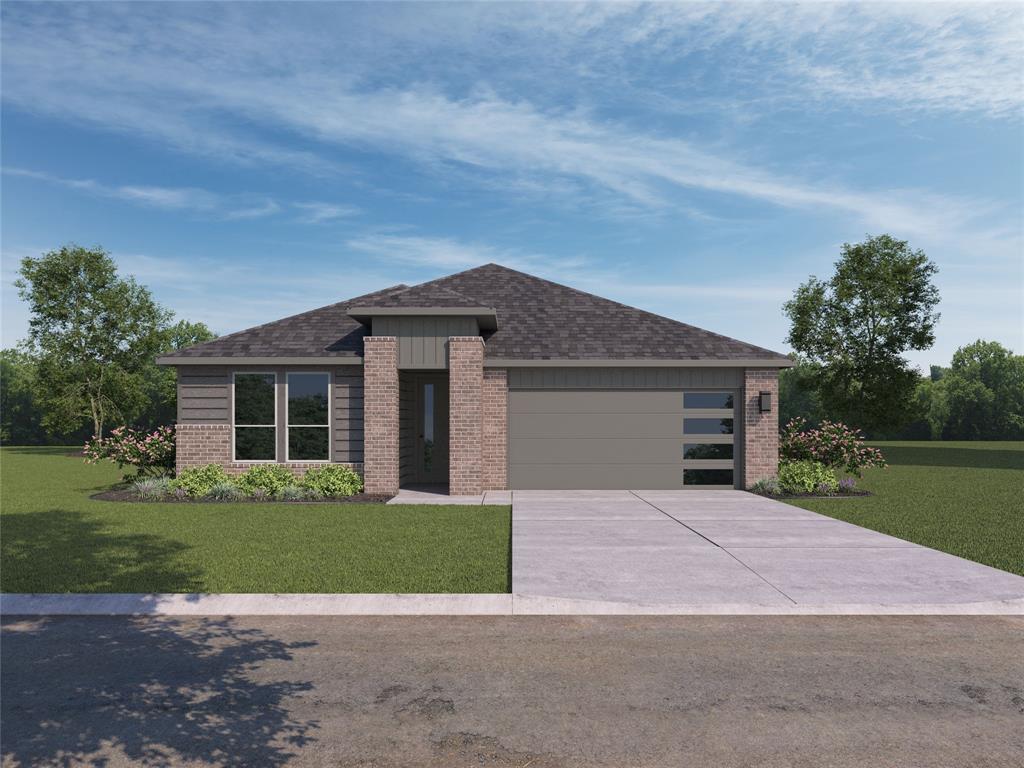 a front view of house with yard and green space