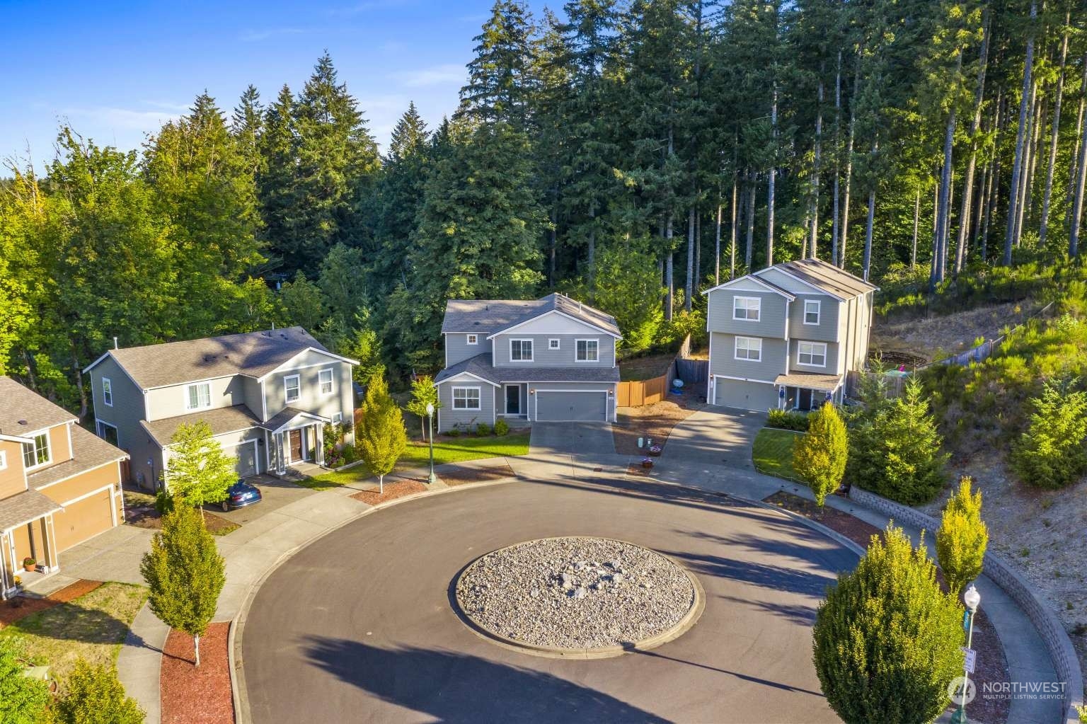 an aerial view of a house with yard patio and outdoor seating