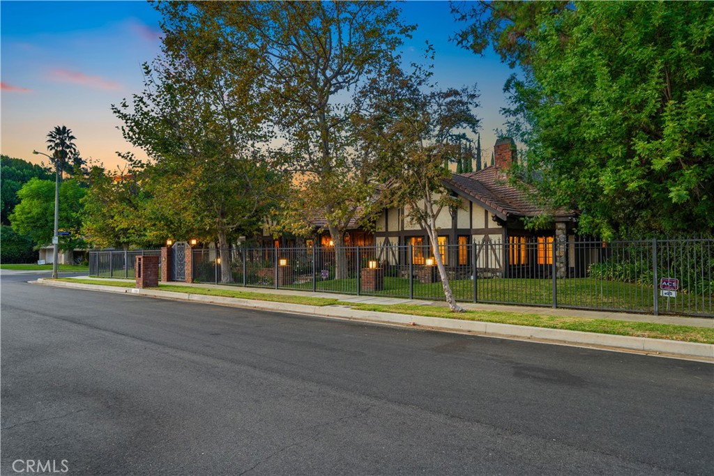 a view of street with trees and playing ground