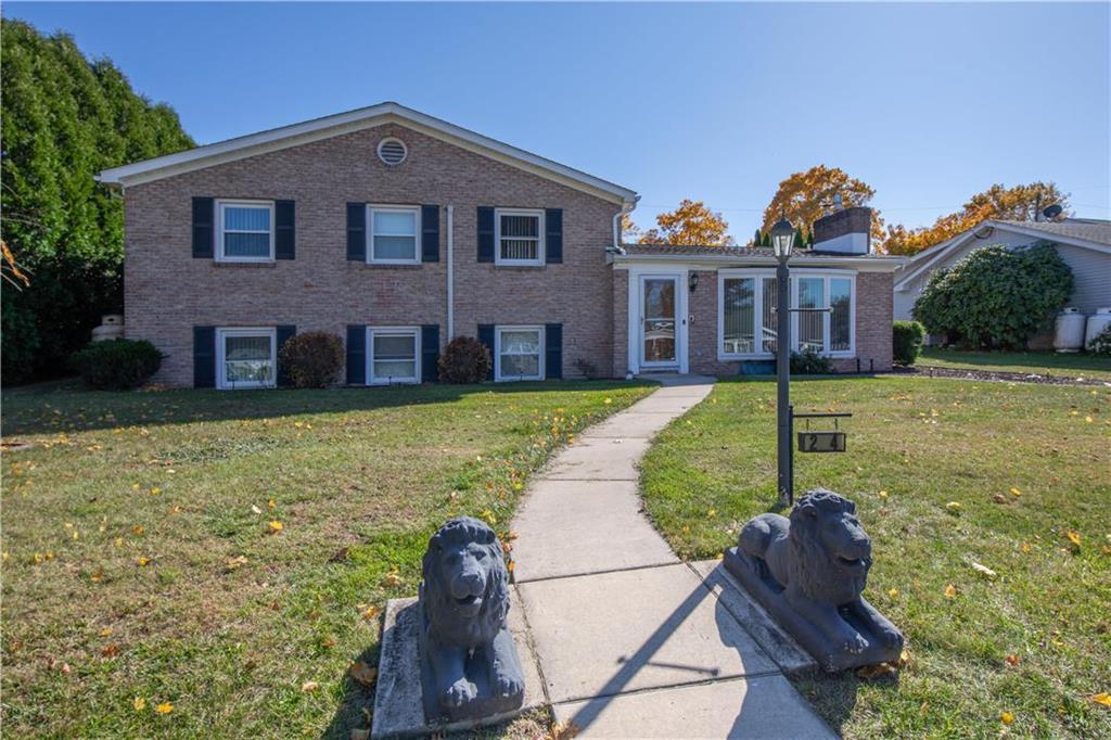 a front view of a house with a yard