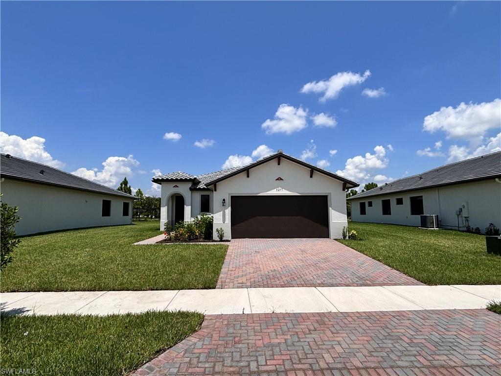 a front view of a house with a yard