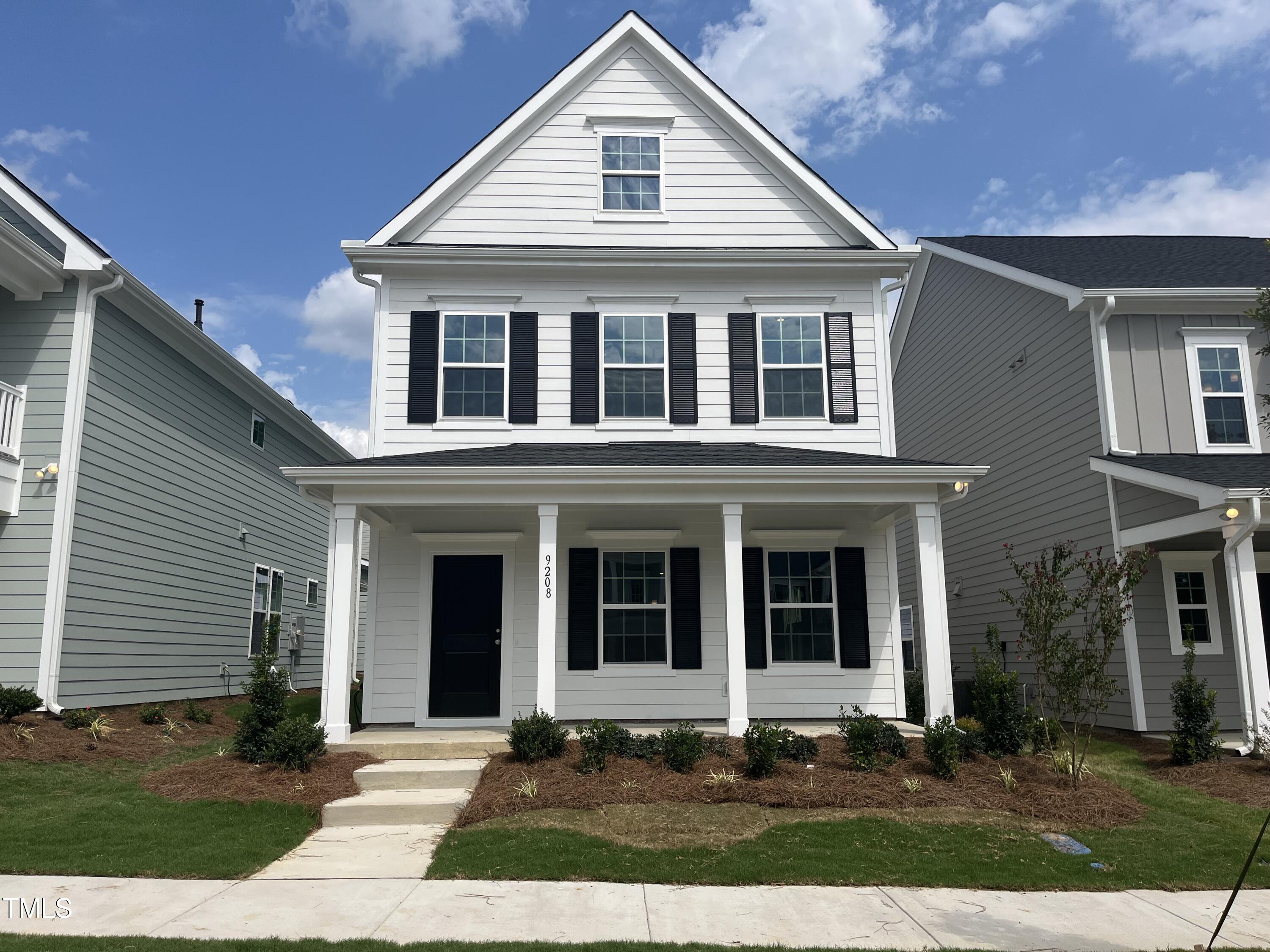 a front view of a house with yard