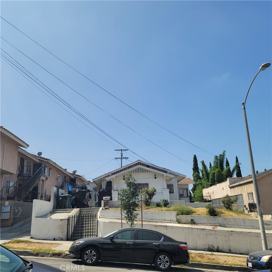 a view of a car parked in front of a house