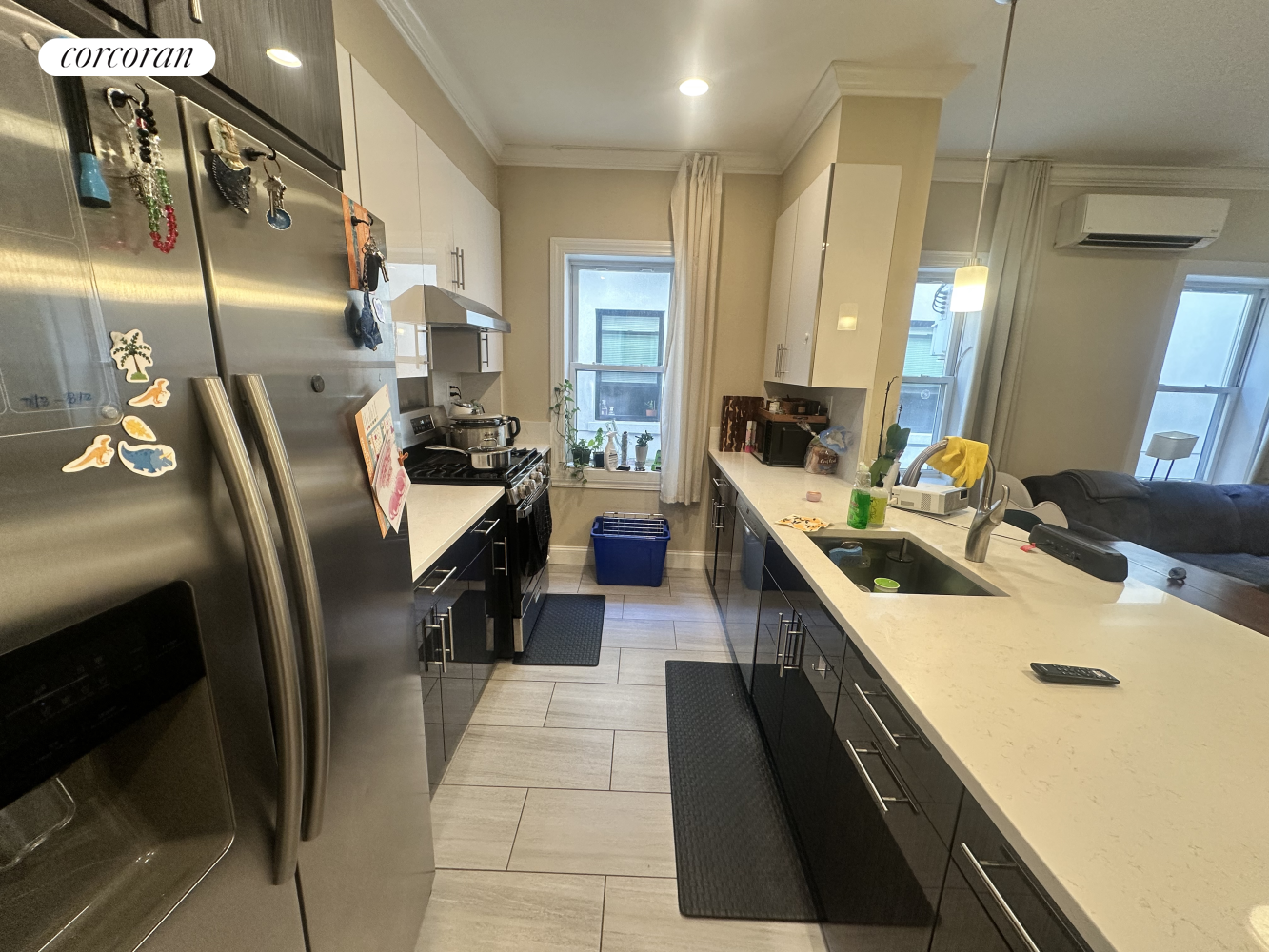 a kitchen with counter top space appliances and windows