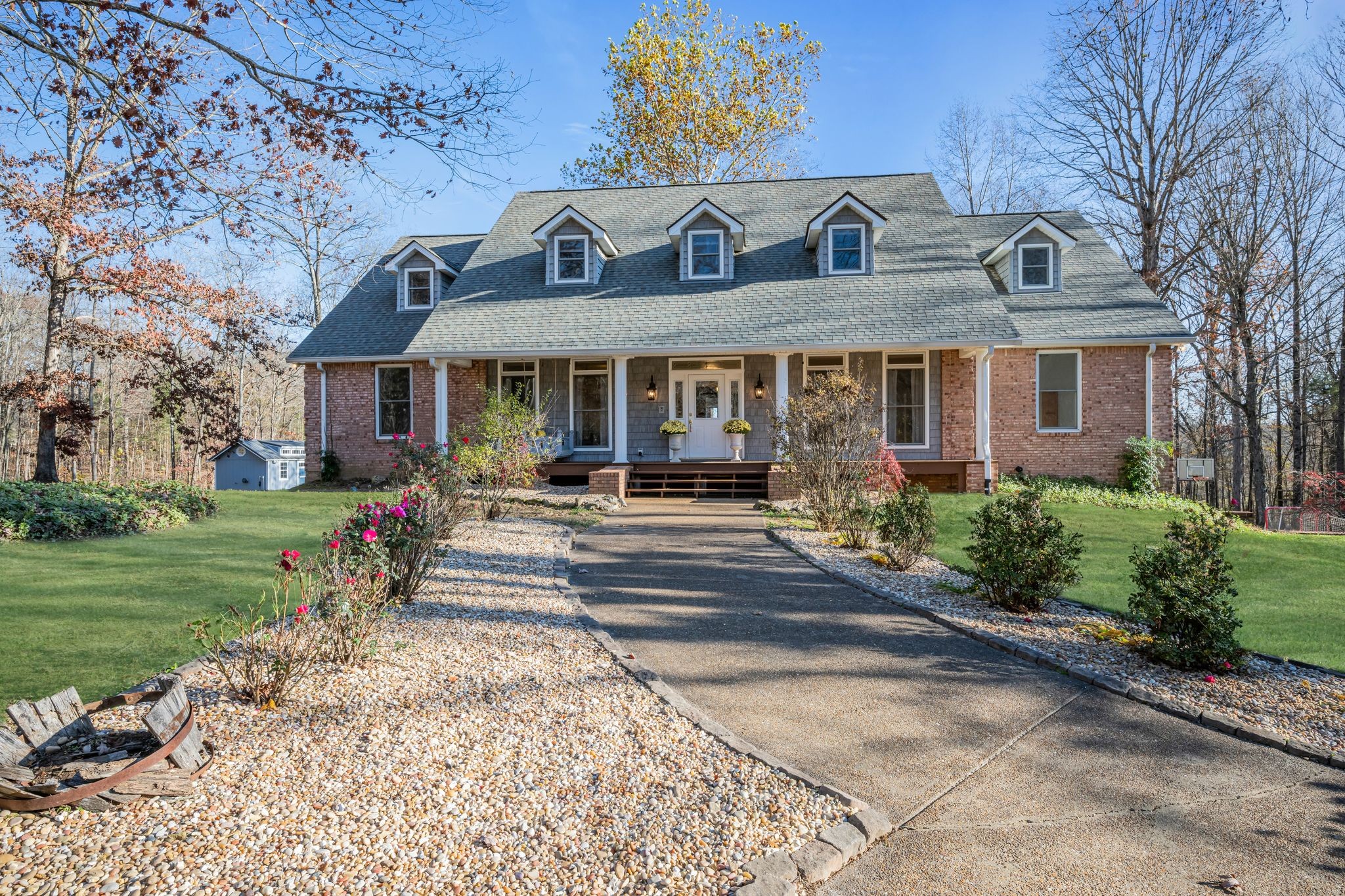 a front view of a house with a yard