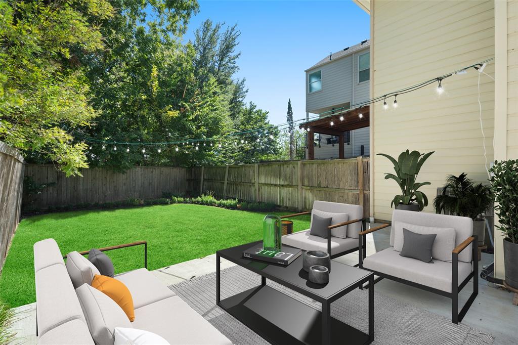 a view of a patio with couches chairs and a yard