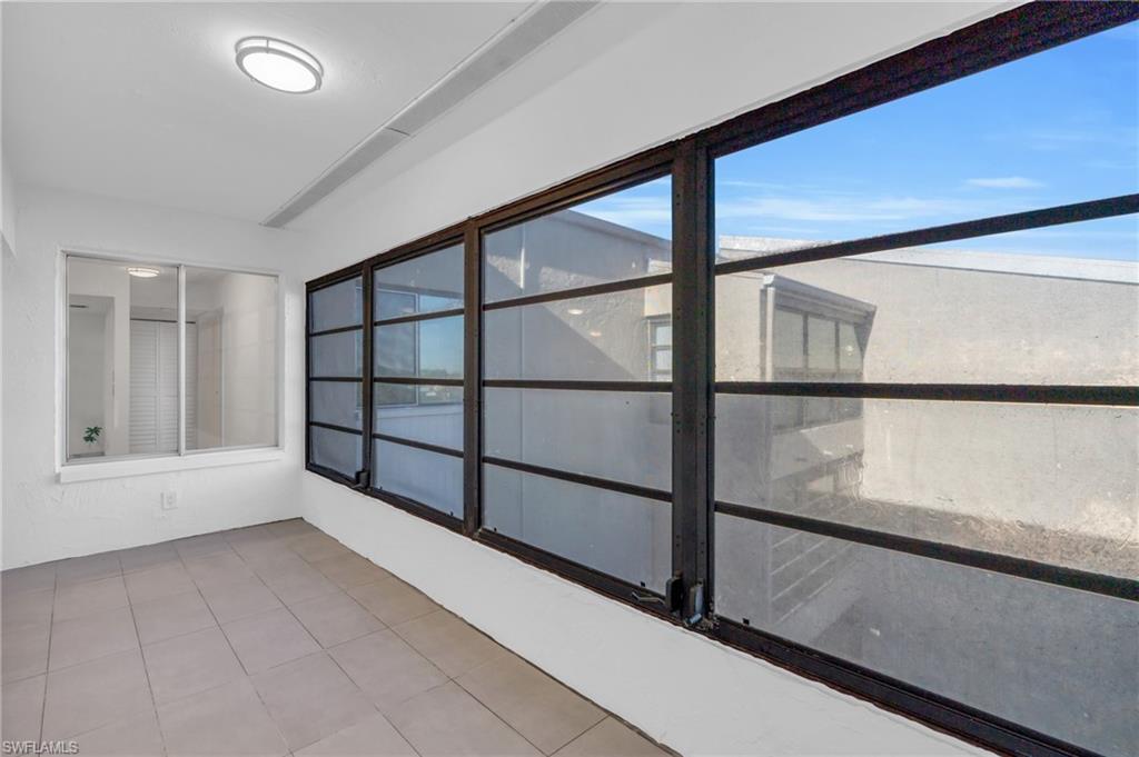 Unfurnished sunroom featuring a healthy amount of sunlight