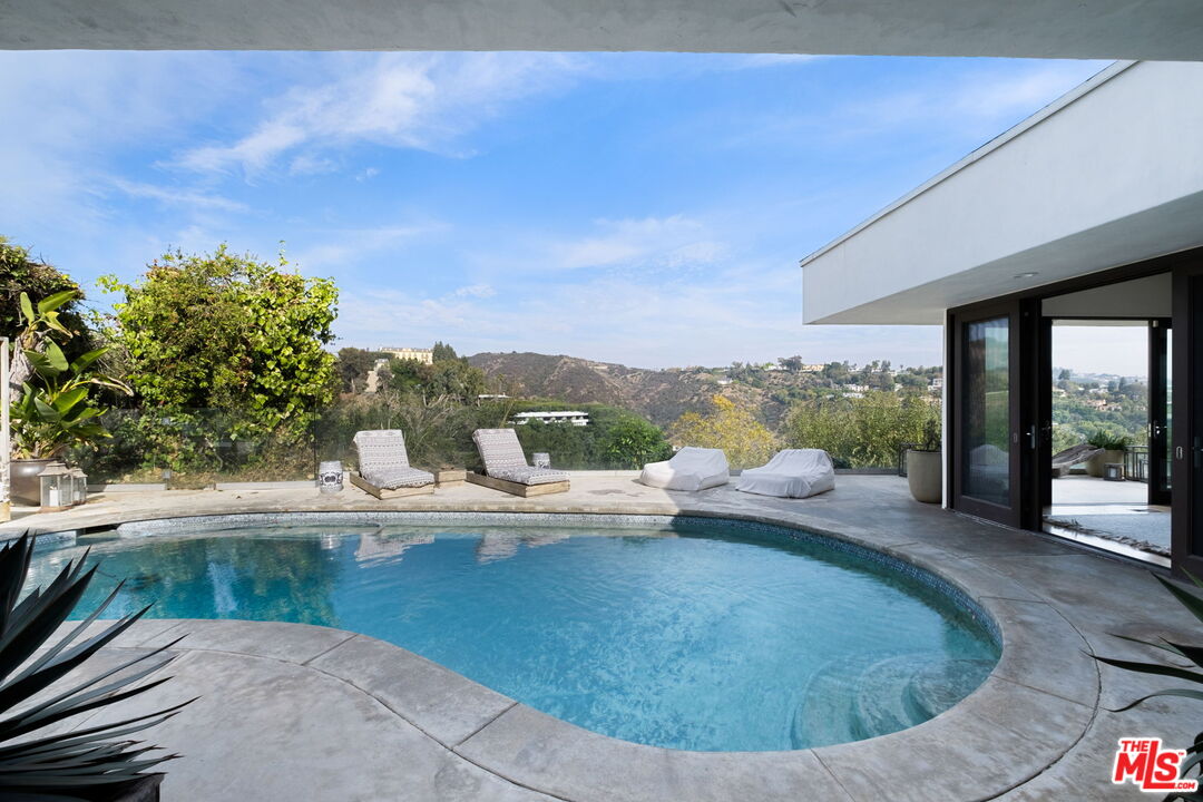 a view of a floor to ceiling window and fire pit