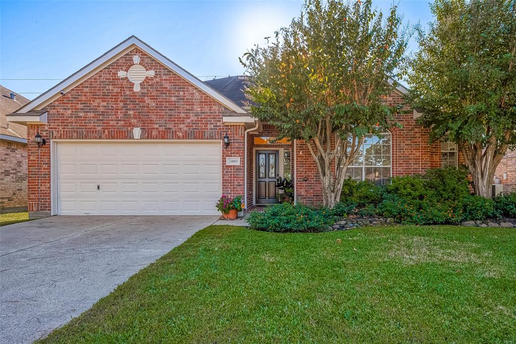 Welcome home! The exterior features - beautiful lush landscape in front and back yard, full brick, sprinkler system, additional breaker panel, gutters at front and back entrance, flood light in back yard, and outlets in the soffit for holiday lights!