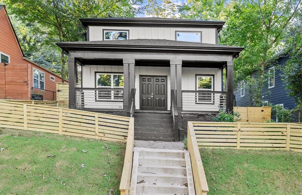 front view of a house with a yard