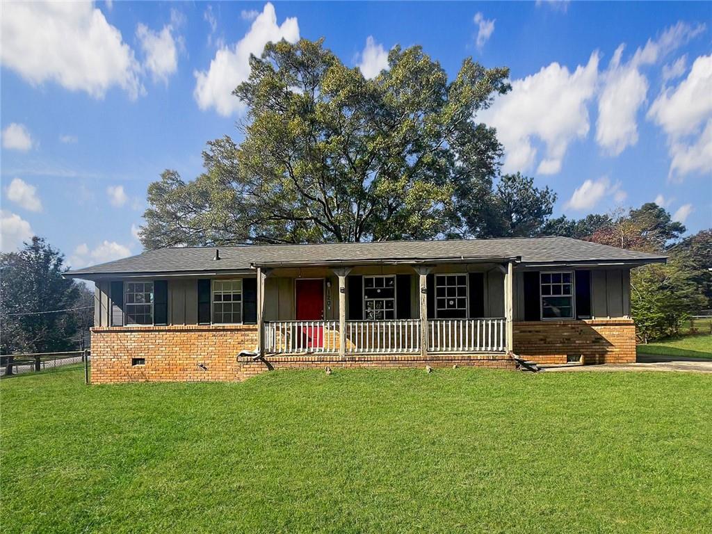 a front view of house with yard with green space