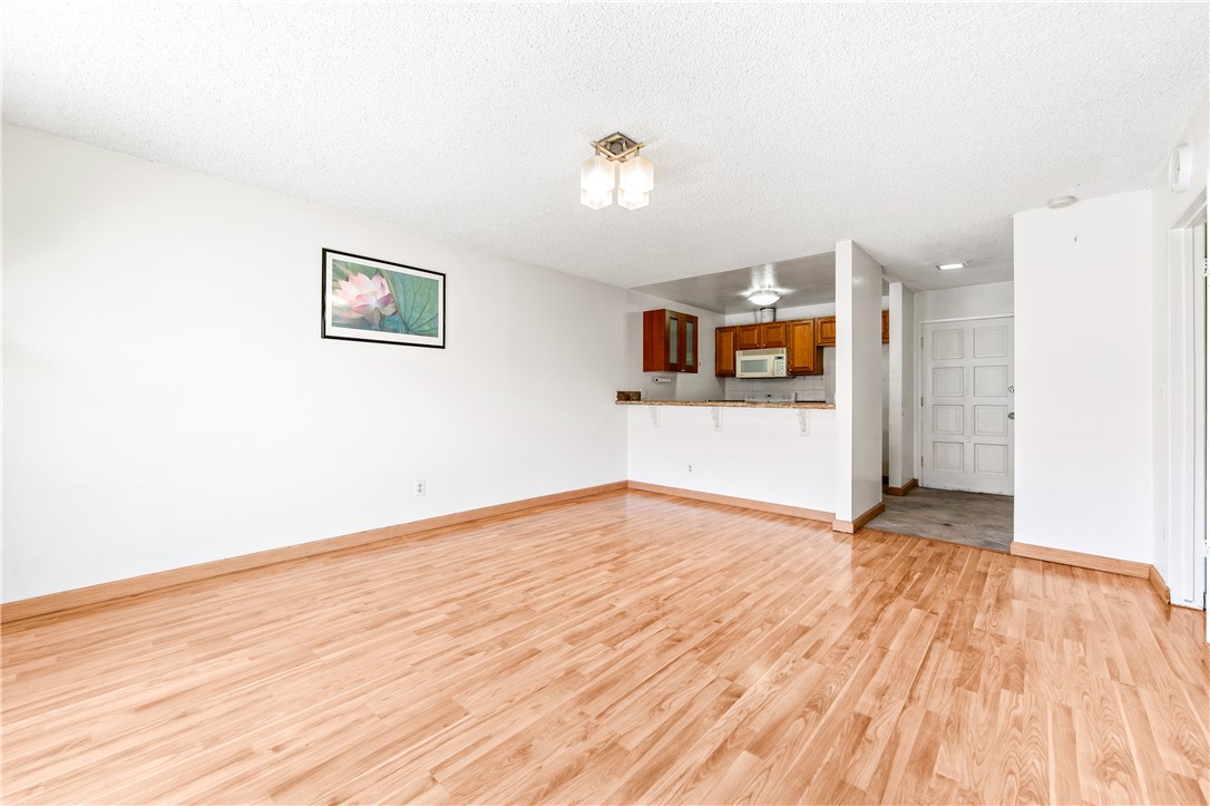 a view of a livingroom with wooden floor