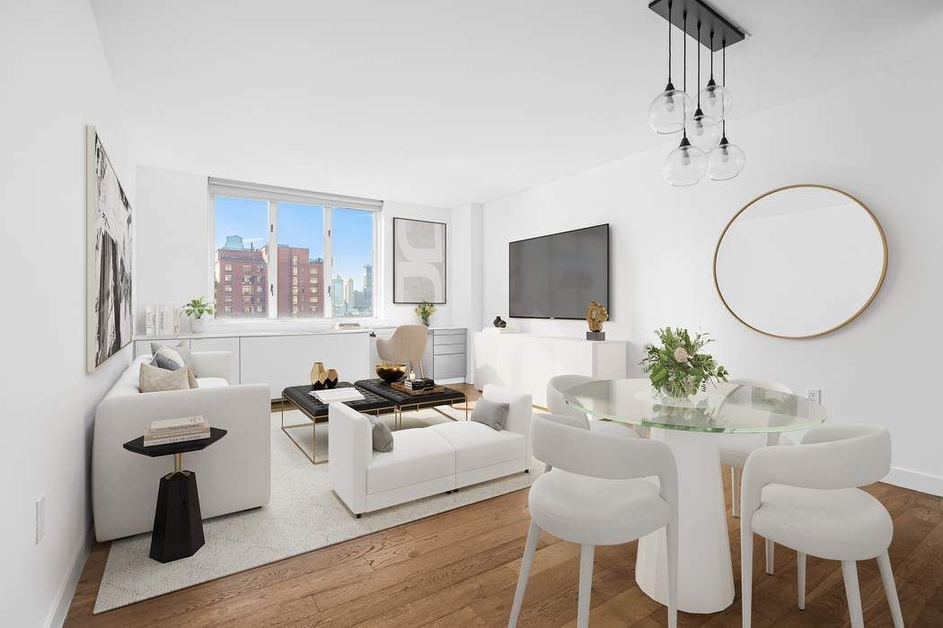 a living room with furniture a mirror and a flat screen tv