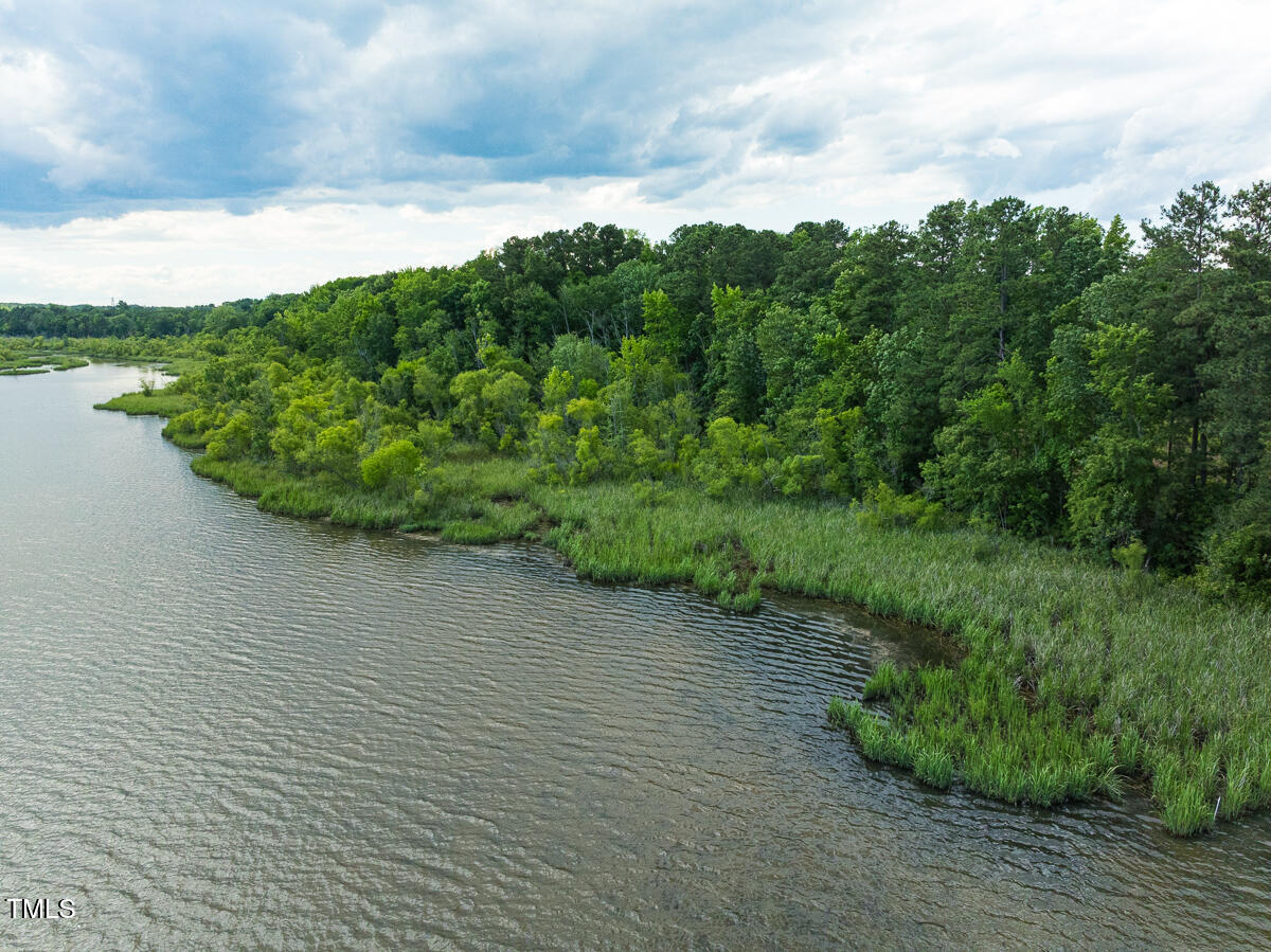 a view of a lake with a yard