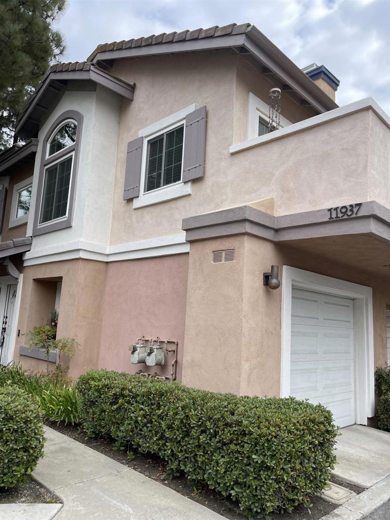 a front view of a house with garage