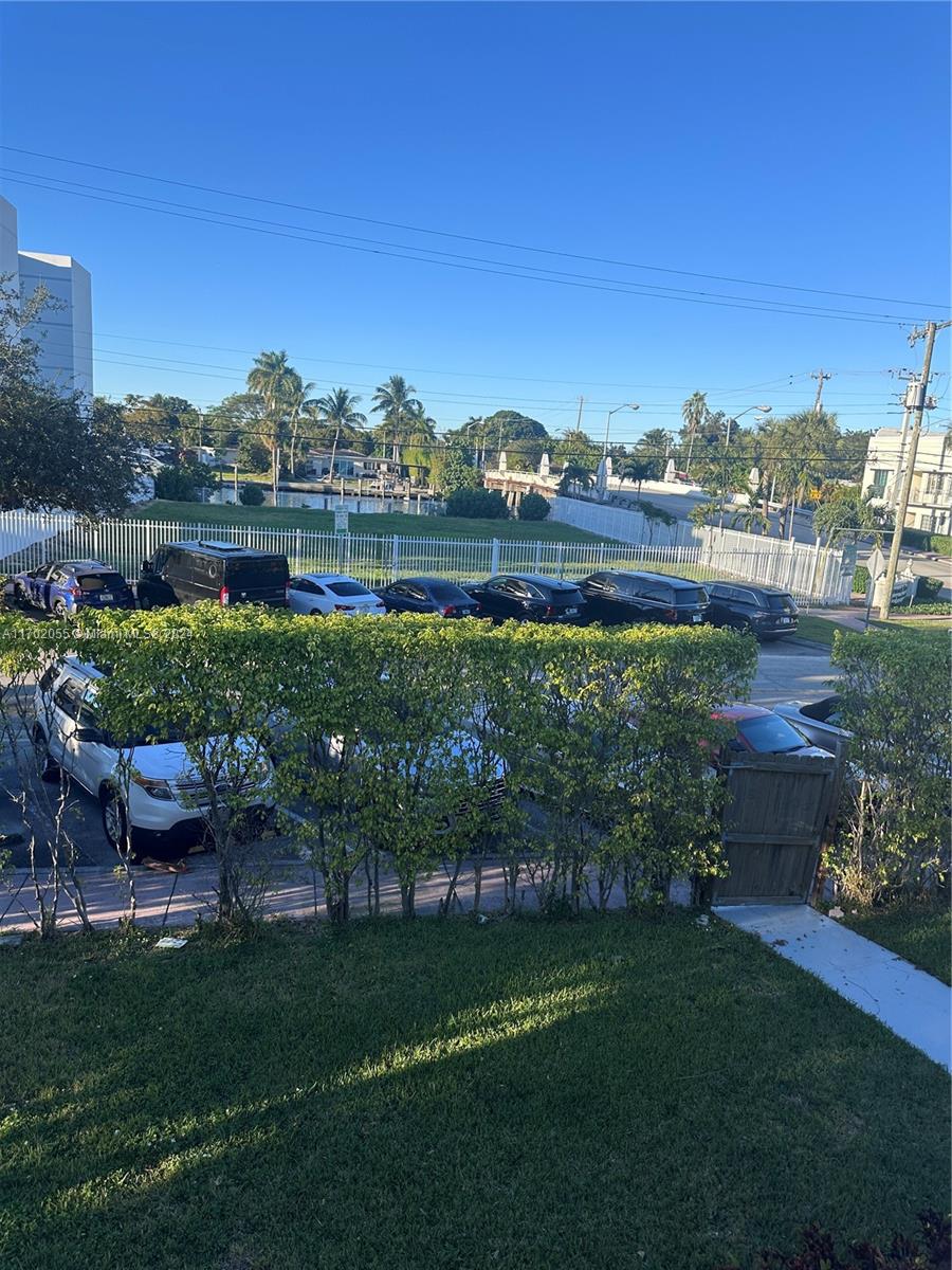 a view of a garden with houses