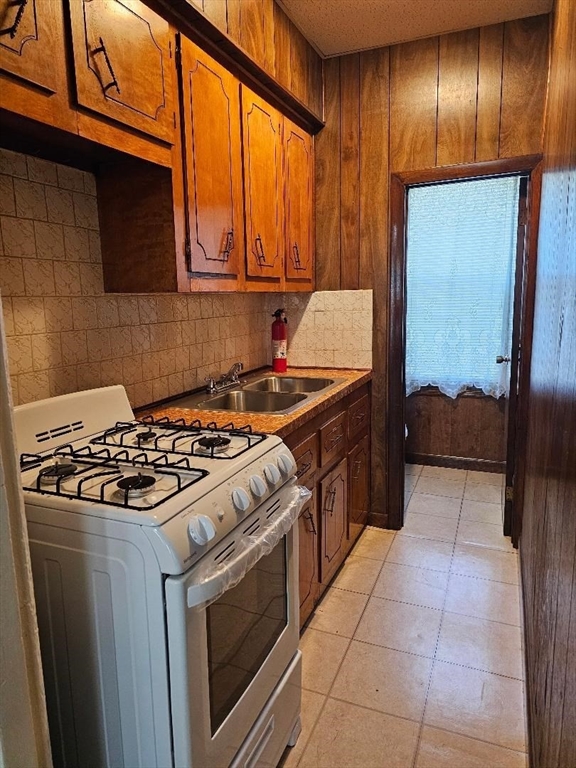 a kitchen with a stove and a refrigerator