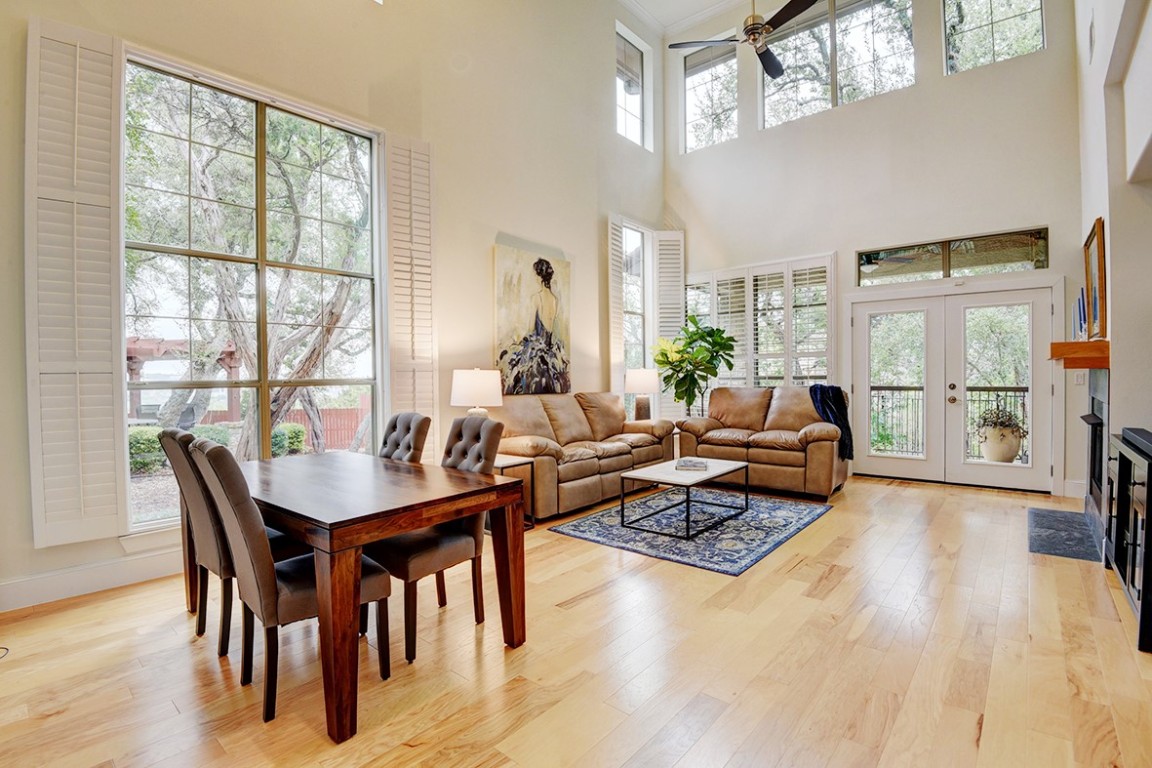 Light and bright main living area with tall windows and plantations shutters to let you be a part of nature.