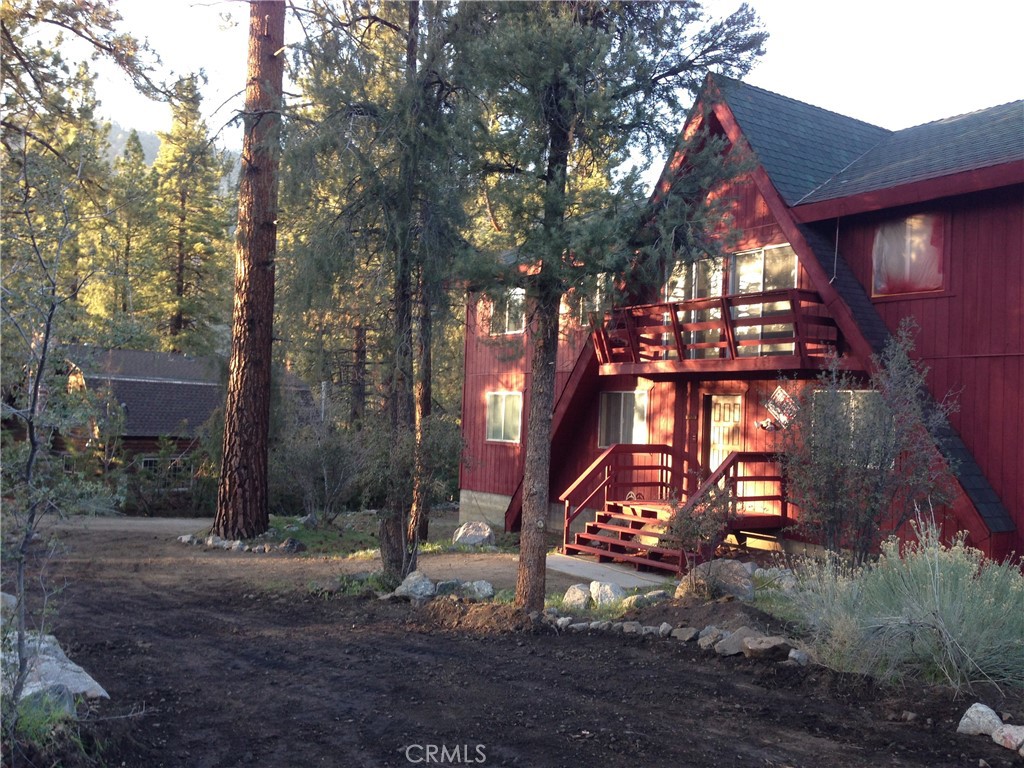 a view of a house with a tree