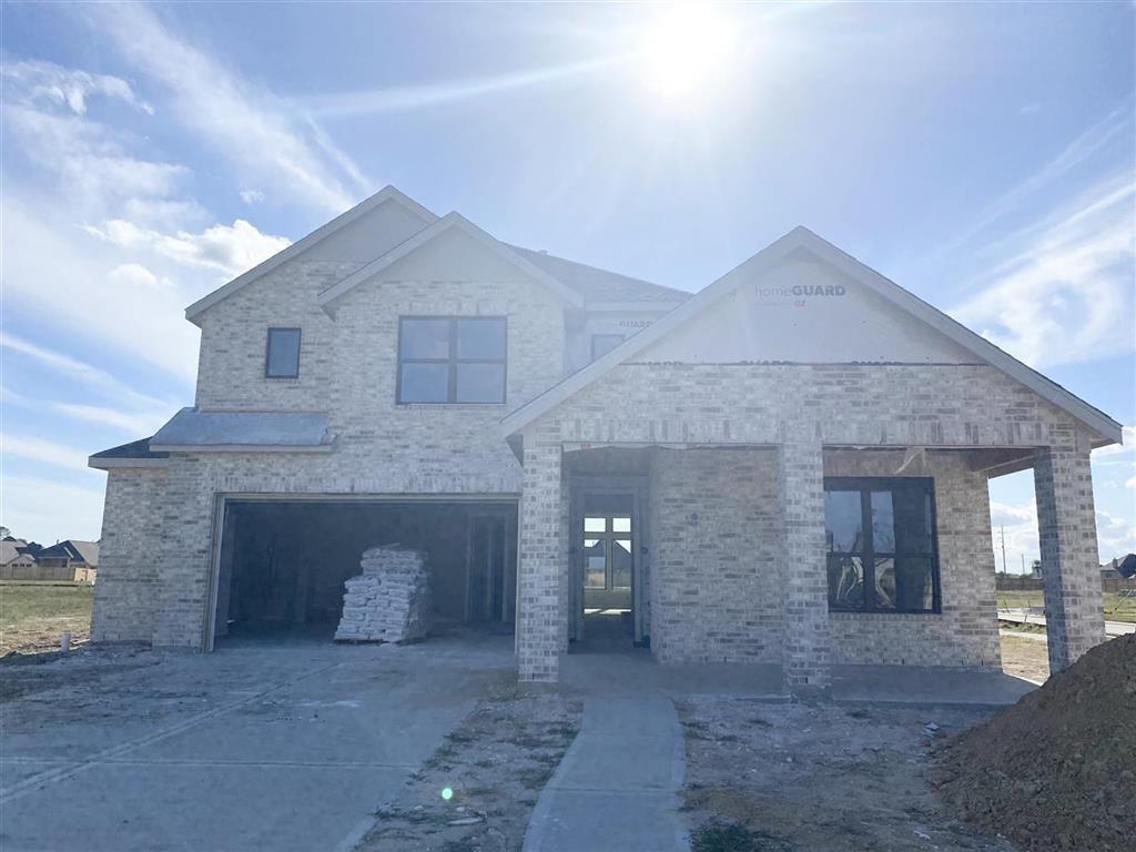 a front view of a house with a garage