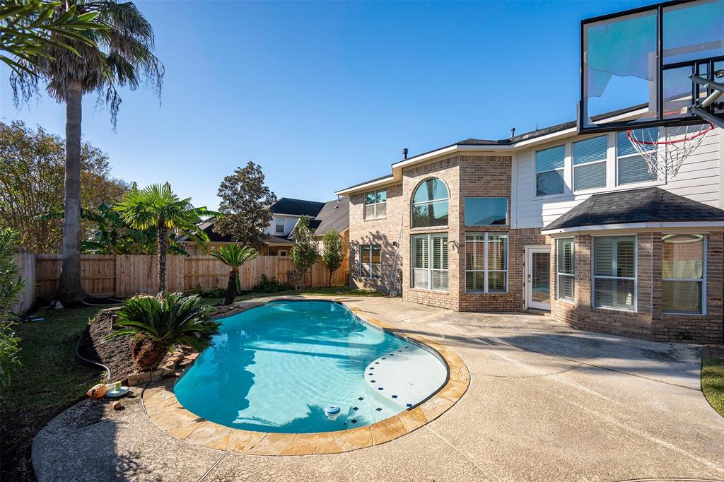 a house view with a swimming pool