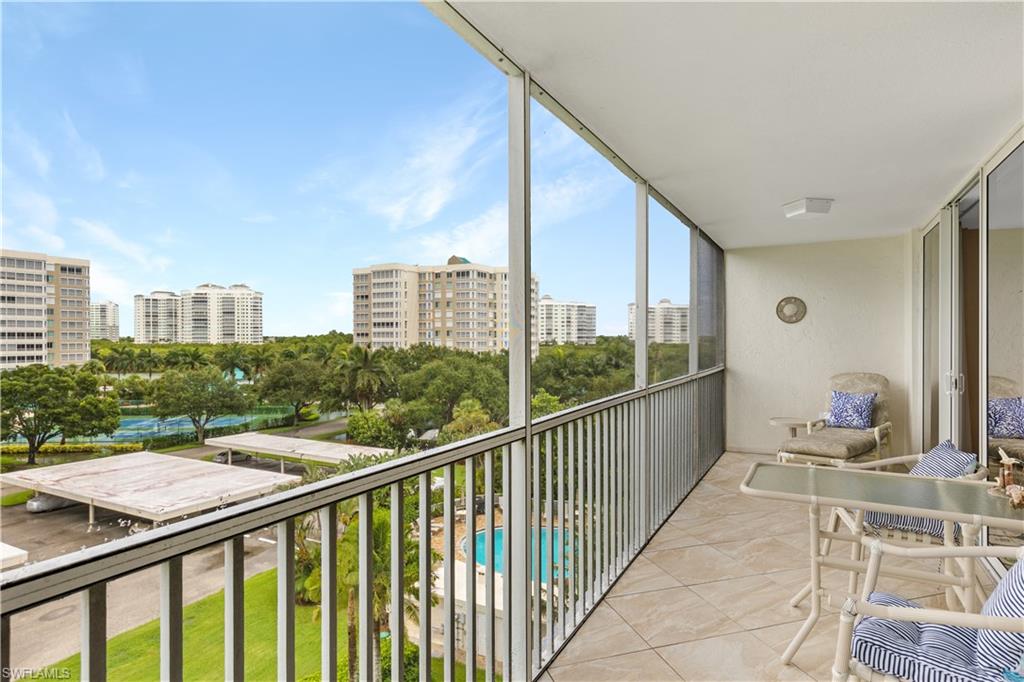 a view of balcony with furniture