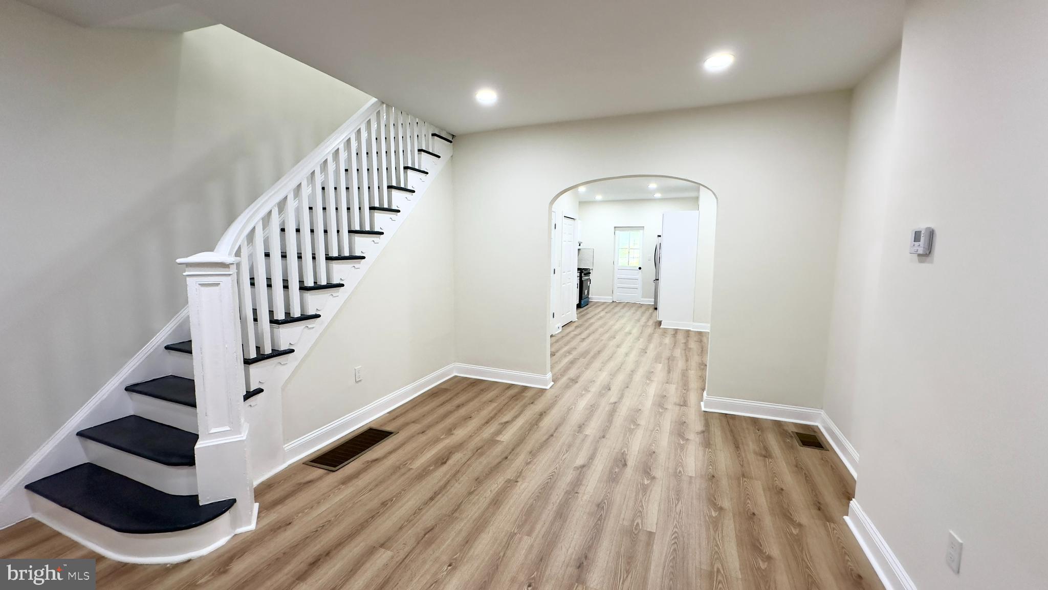 a view of entryway with wooden floor