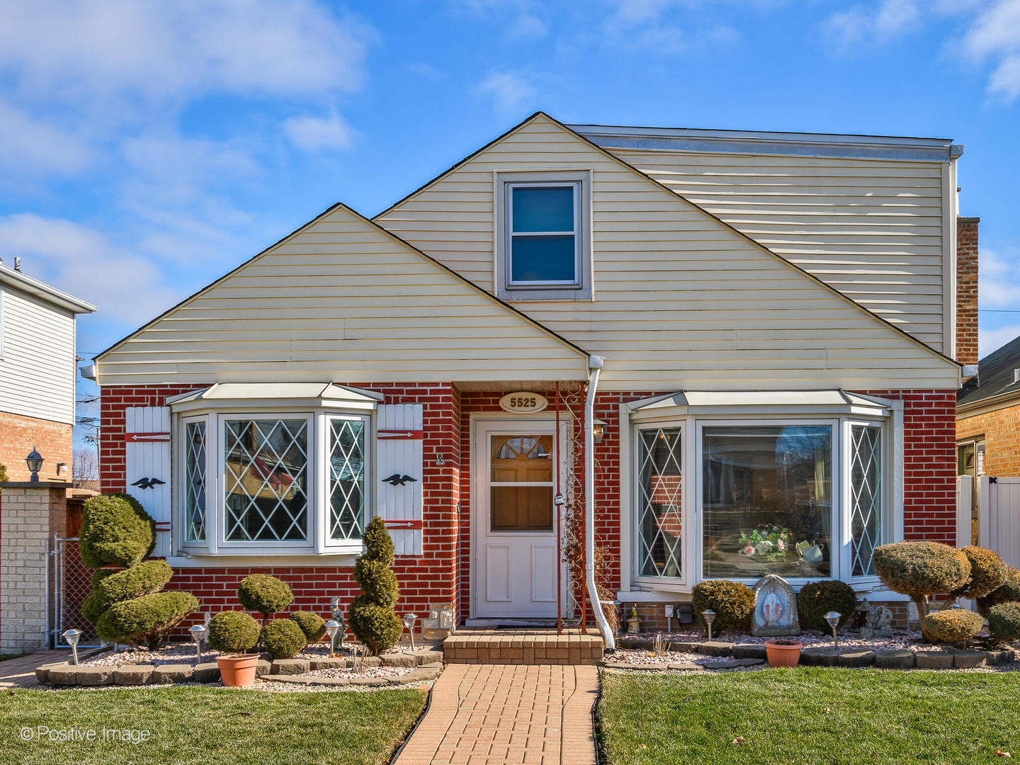 a front view of house with outdoor seating