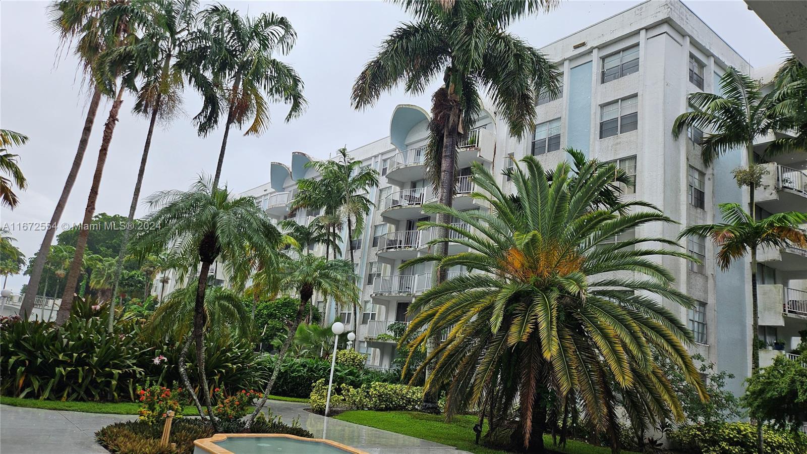 a view of outdoor space with palm trees